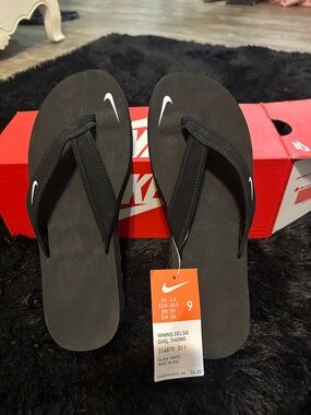 Nike Black Women's Celso Thong Sandals with White Swoosh